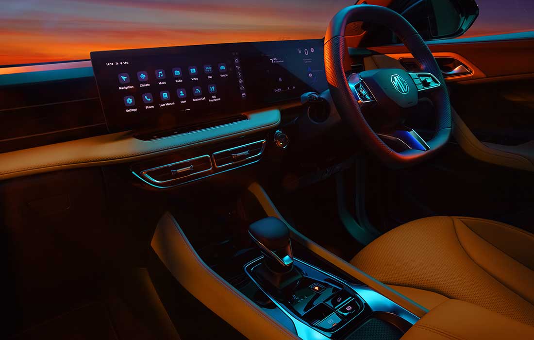Modern digital dashboard and steering wheel inside an MG taxi.