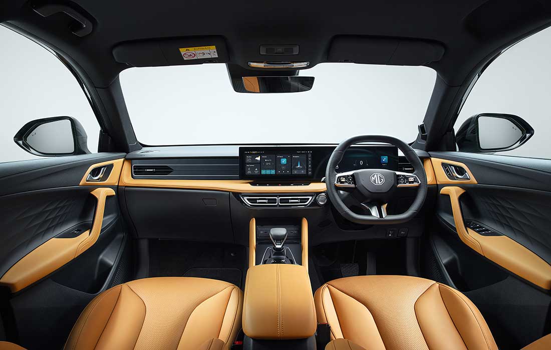 Interior of an MG taxi featuring a digital infotainment screen, multifunction steering wheel, and tan leather-style seats.