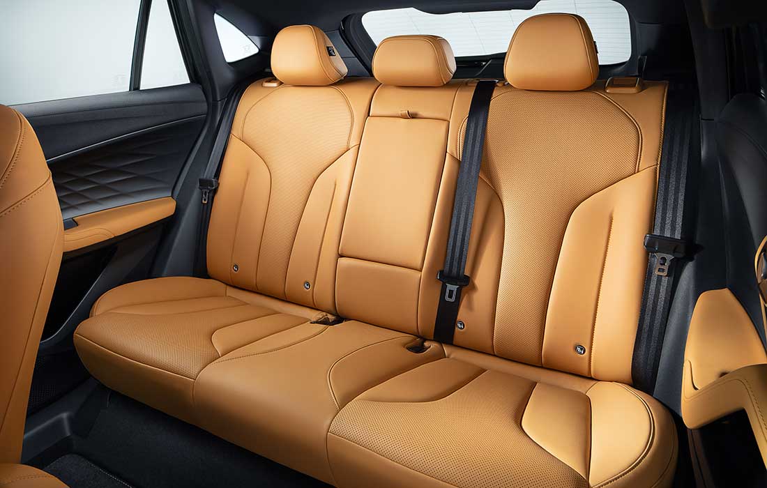 Tan leather rear seating in a taxi.