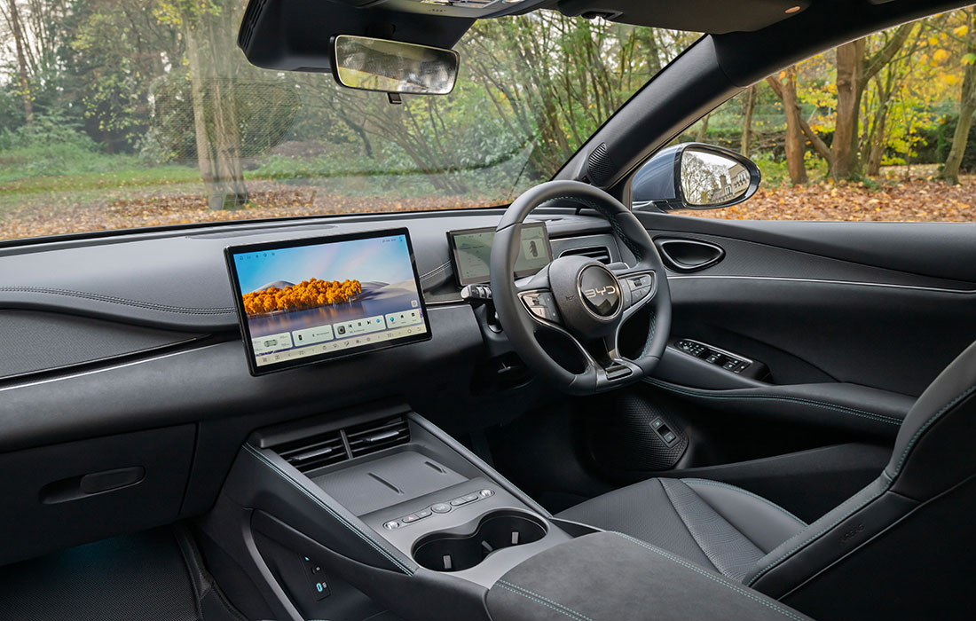 Interior view of a BYD taxi featuring the dashboard, touchscreen infotainment display, and steering wheel.