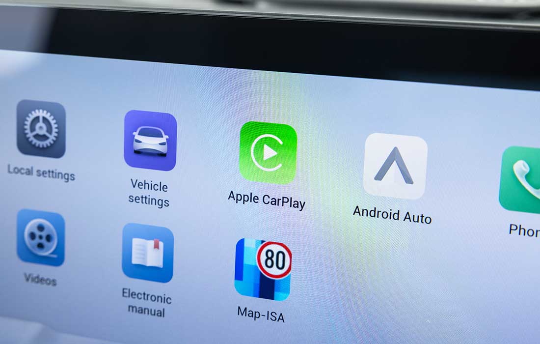 Digital touchscreen taxi display featuring Apple CarPlay, Android Auto, and vehicle settings.