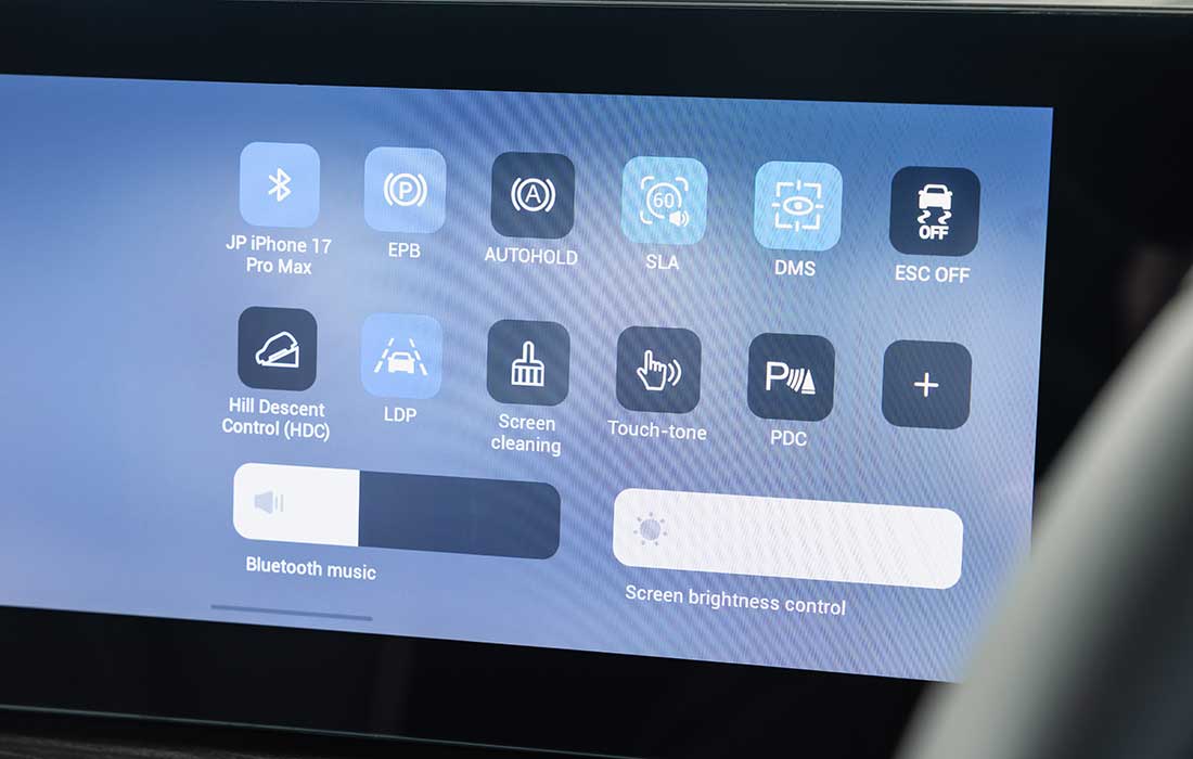 Digital touchscreen taxi menu displaying vehicle control icons for hill descent, parking sensors, and screen brightness.