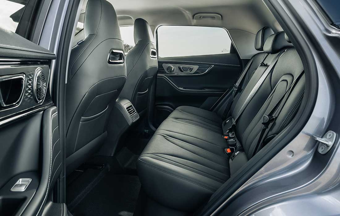 Spacious rear passenger seating area inside a taxi cab.
